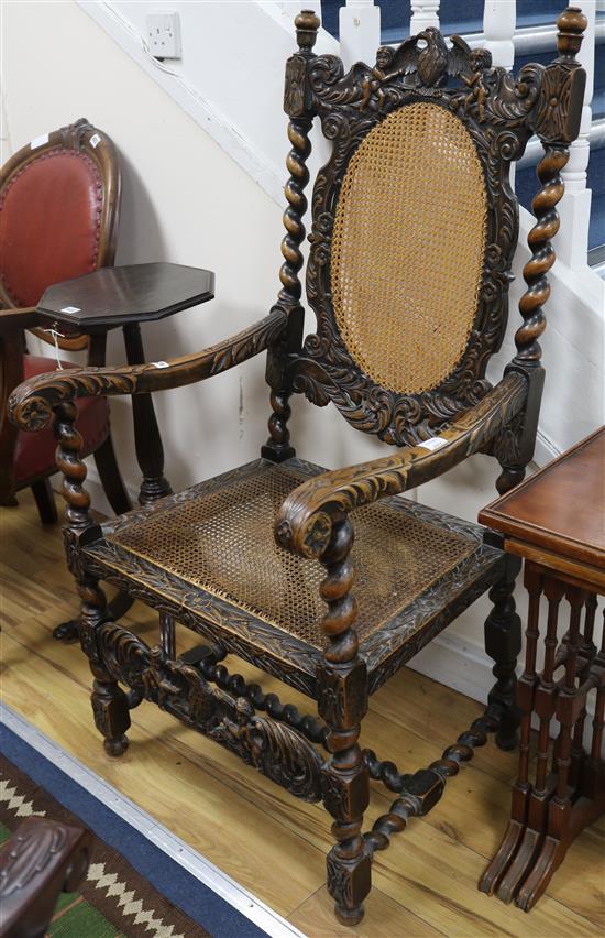 A Carolean style carved walnut caned seat and back elbow chair